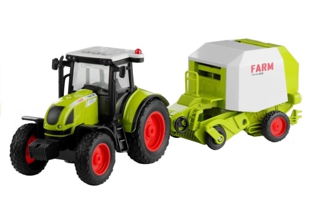 Traktor s stiskalnico za bale