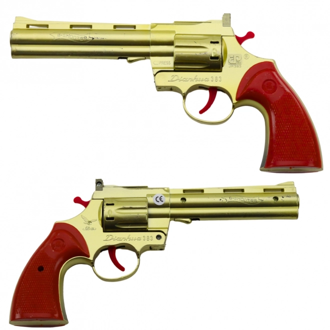Zlati revolver na kapsle z zvočnim učinkom strela