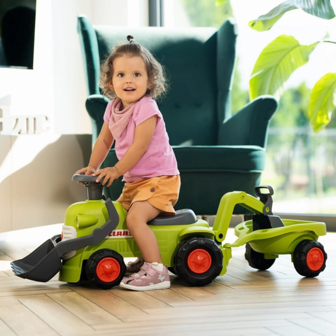 Vozni traktor Claas s prikolico, nakladalnikom in žlico