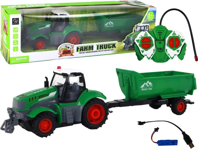 Daljinsko voden traktor s prikolico 1:24, zelen