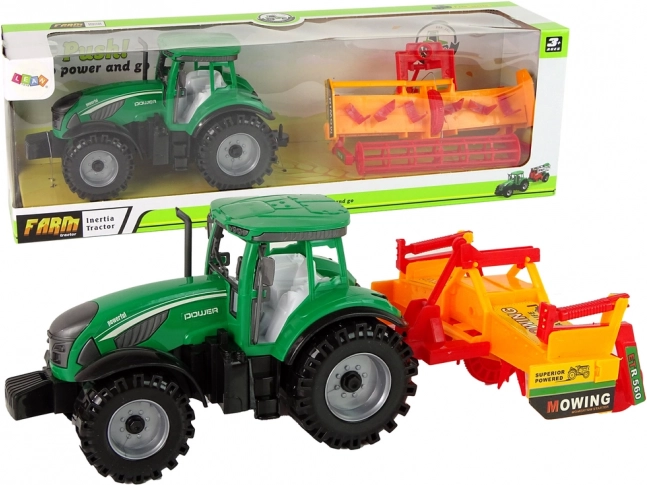 Zeleni traktor z oranžnim kultivatorjem – komplet s vztrajnikom za otroke