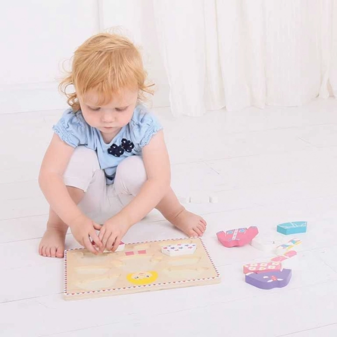 Bigjigs Baby oblačenje sestavljanka deklica