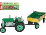 Zeleni traktor Zetor s prikolico in vzmetnim mehanizmom Kovap