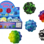 Barvasta žogica z izboklinami 6,5 cm – skakalna in stiskalna antistresna igrača