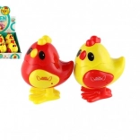 Skakajoče plastično piščančke na navijanje 7 × 9 cm, 2 barvi