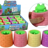 Antistresna igrača žabica, ki skoči iz soda