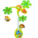 Glasbeni vrtiljak HOLA nad posteljico z glasbeno skrinjico in ropotuljicami