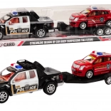 Policijski pickup z vlečno prikolico in terenskim avtomobilom