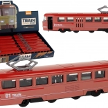 Rdeč kovinski vlak s trenjskim pogonom in zvoki