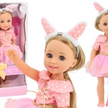 Lutka z rožnatimi oblekami, dolgimi lasmi in naglavnim trakom, 38 cm