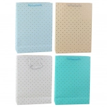 Darilna vrečka z zlatimi pikami